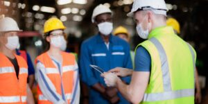 Safety-director-providing-health-and-safety-orientation-to-a-team-scaled-1-1200x799