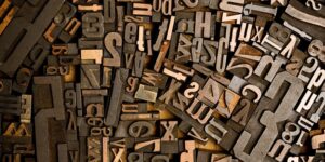 A bunch of pieces of wood type. Makes a great background image. The two credit size would make a killer desktop background for any designer.